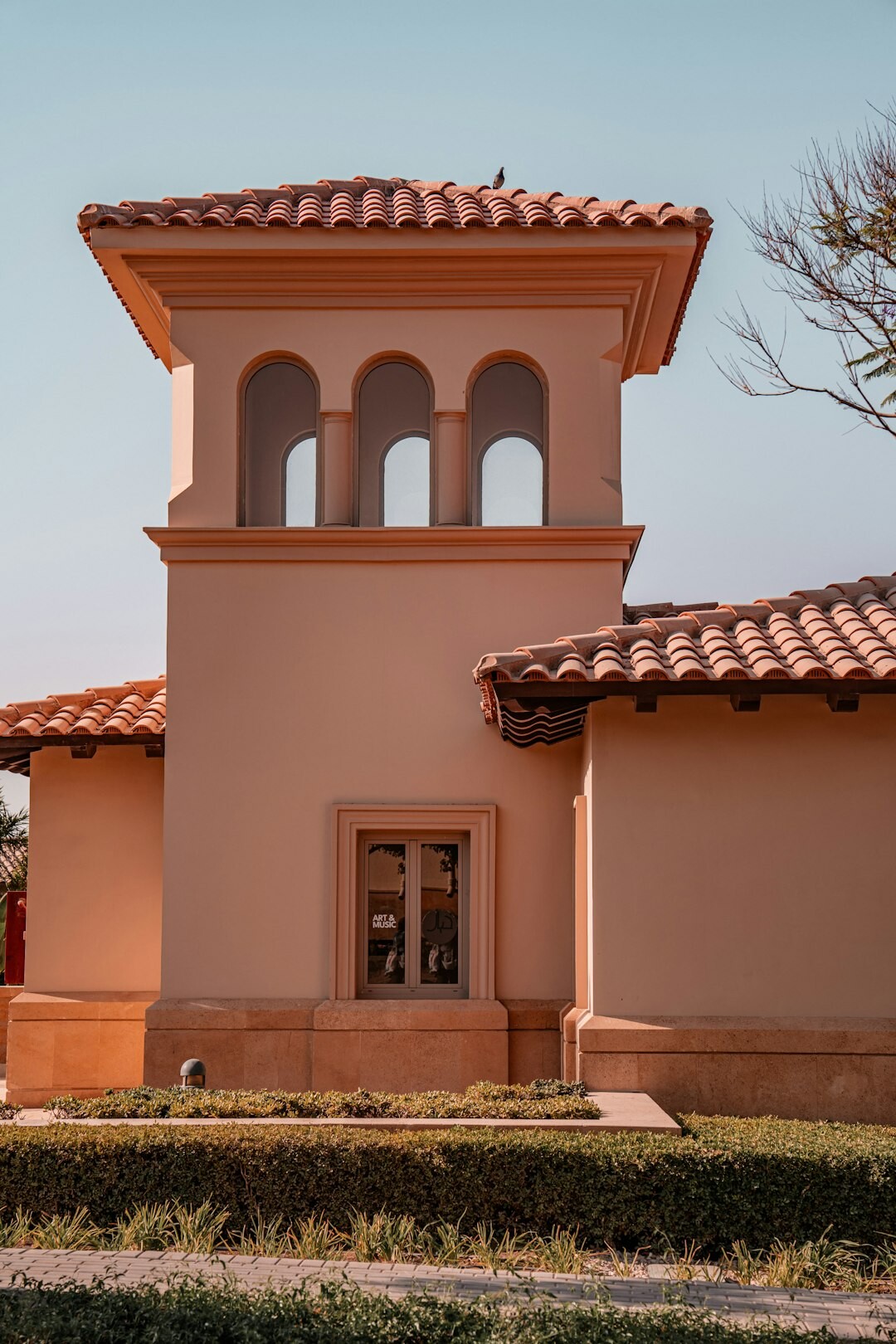 Exterior of a warm community center building with a welcoming entrance